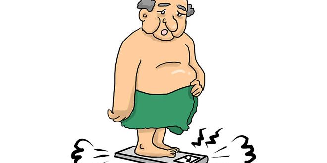 Uomo grasso sulla bilancia